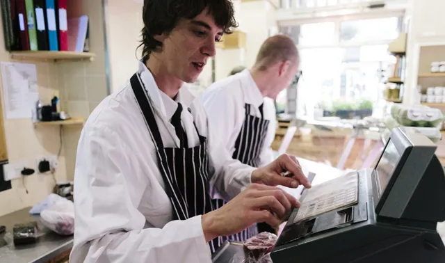 UK inflation falls as meat and crumpet prices drop